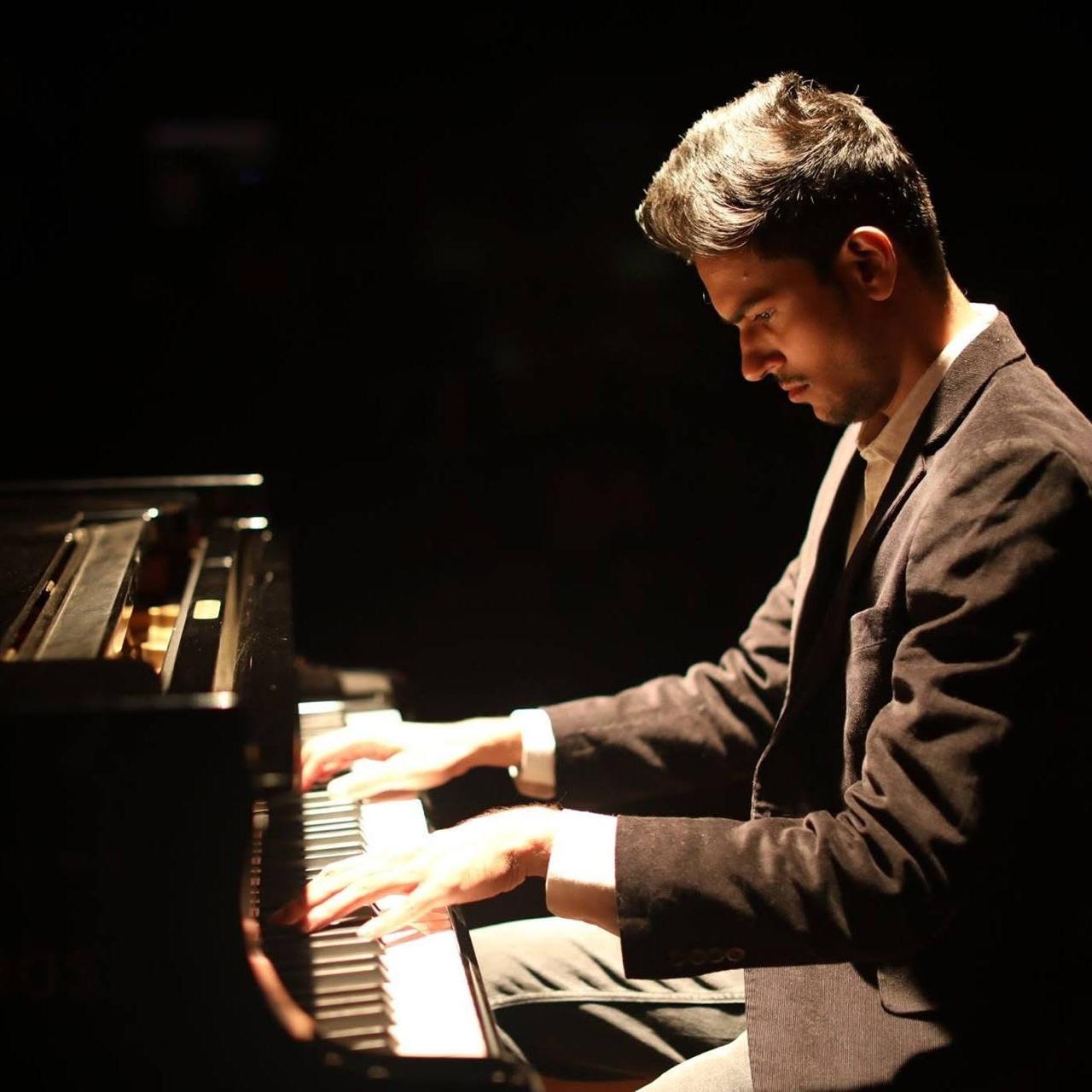 Akash Mistry playing the piano